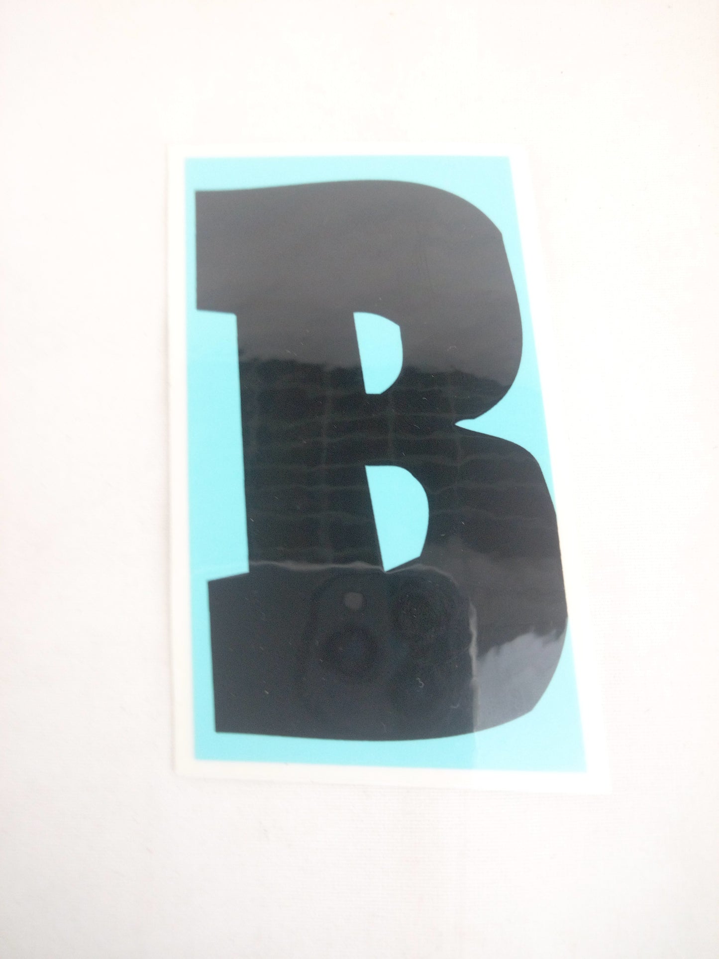 Baker B Clear Blue Black 3.75" x 3.25" Sticker